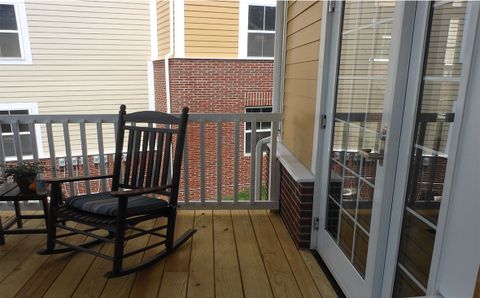a rocking chair on a porch